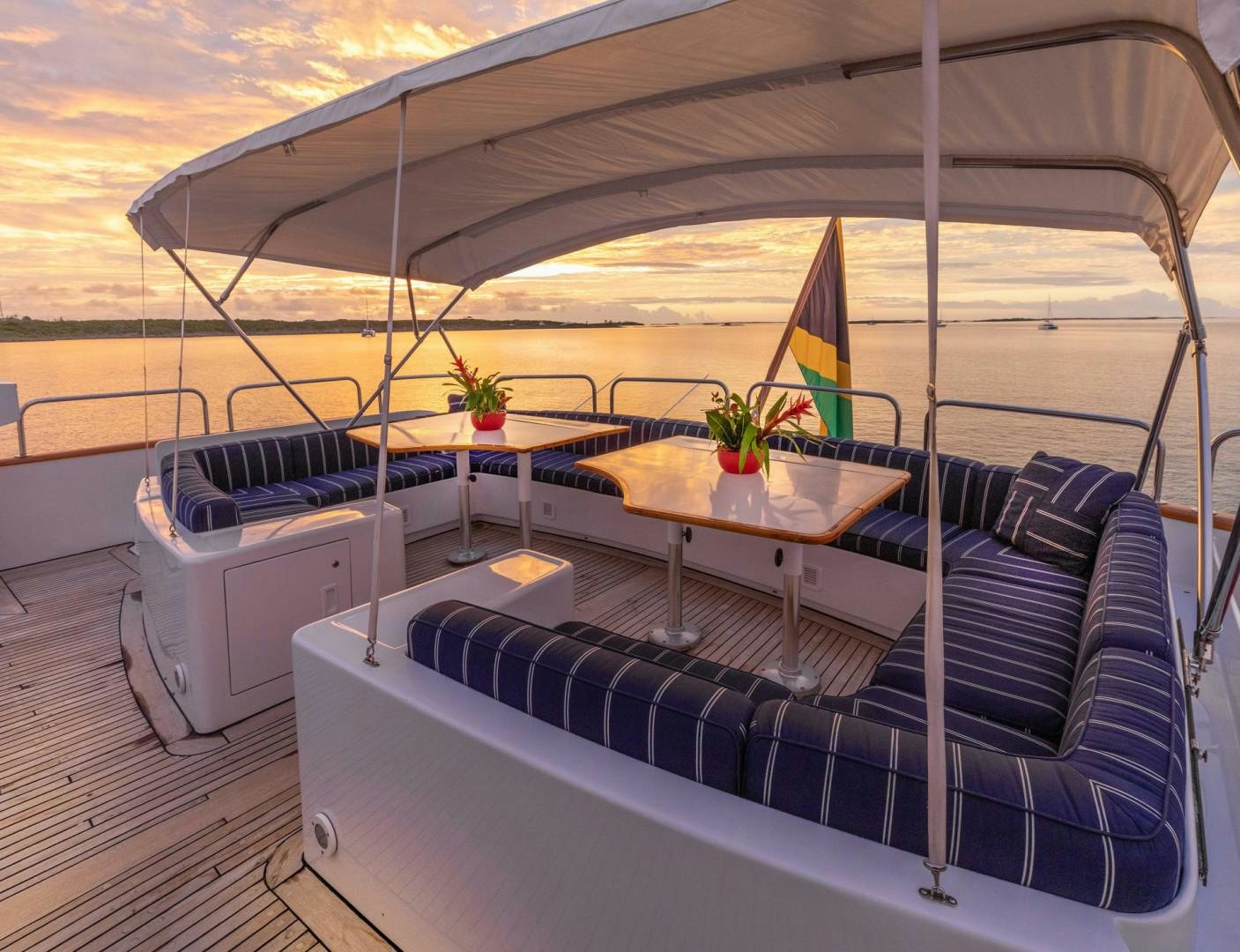 a boat with a table and chairs aboard RENA Yacht for Charter