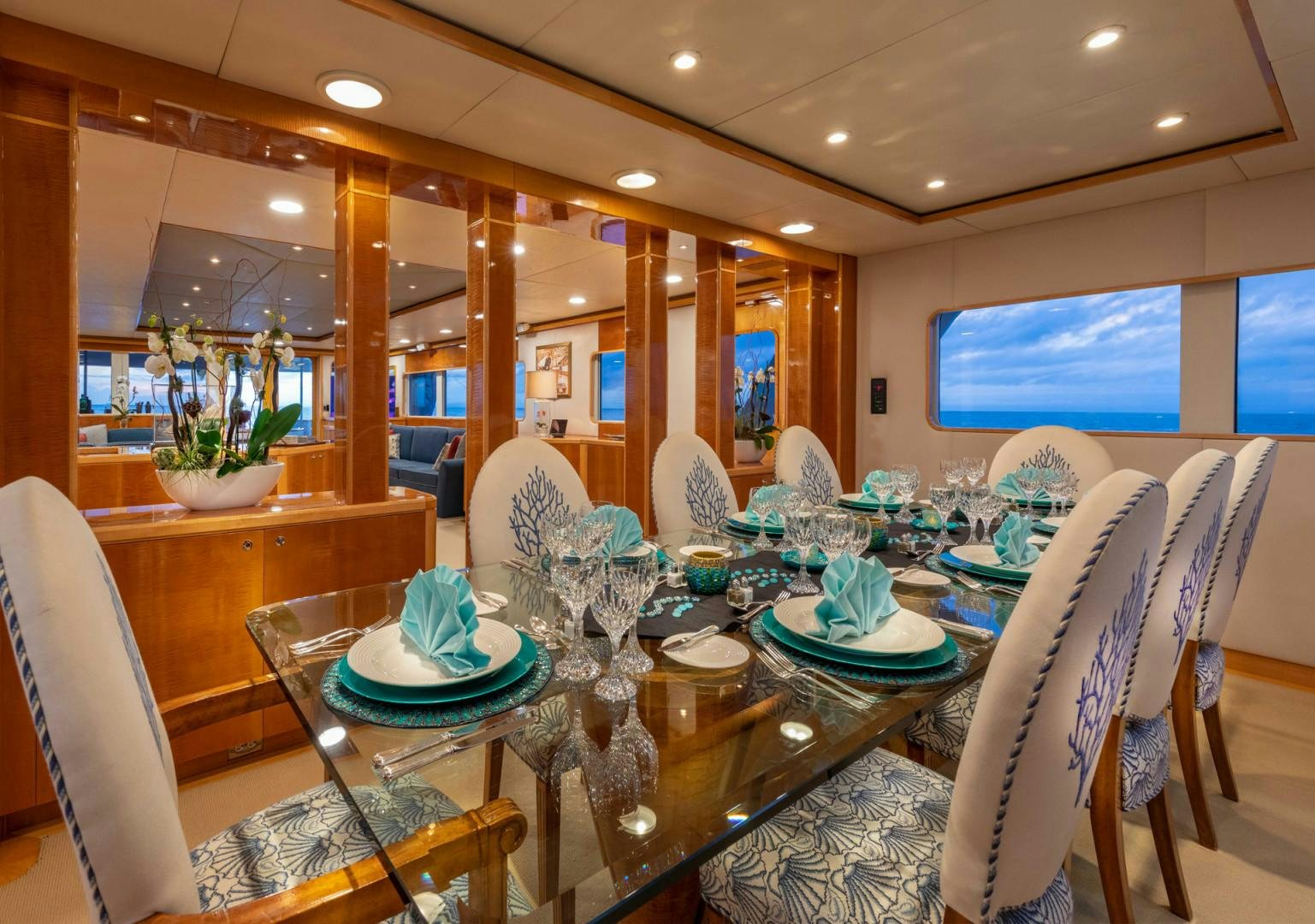 a large room with a table and chairs aboard RENA Yacht for Charter