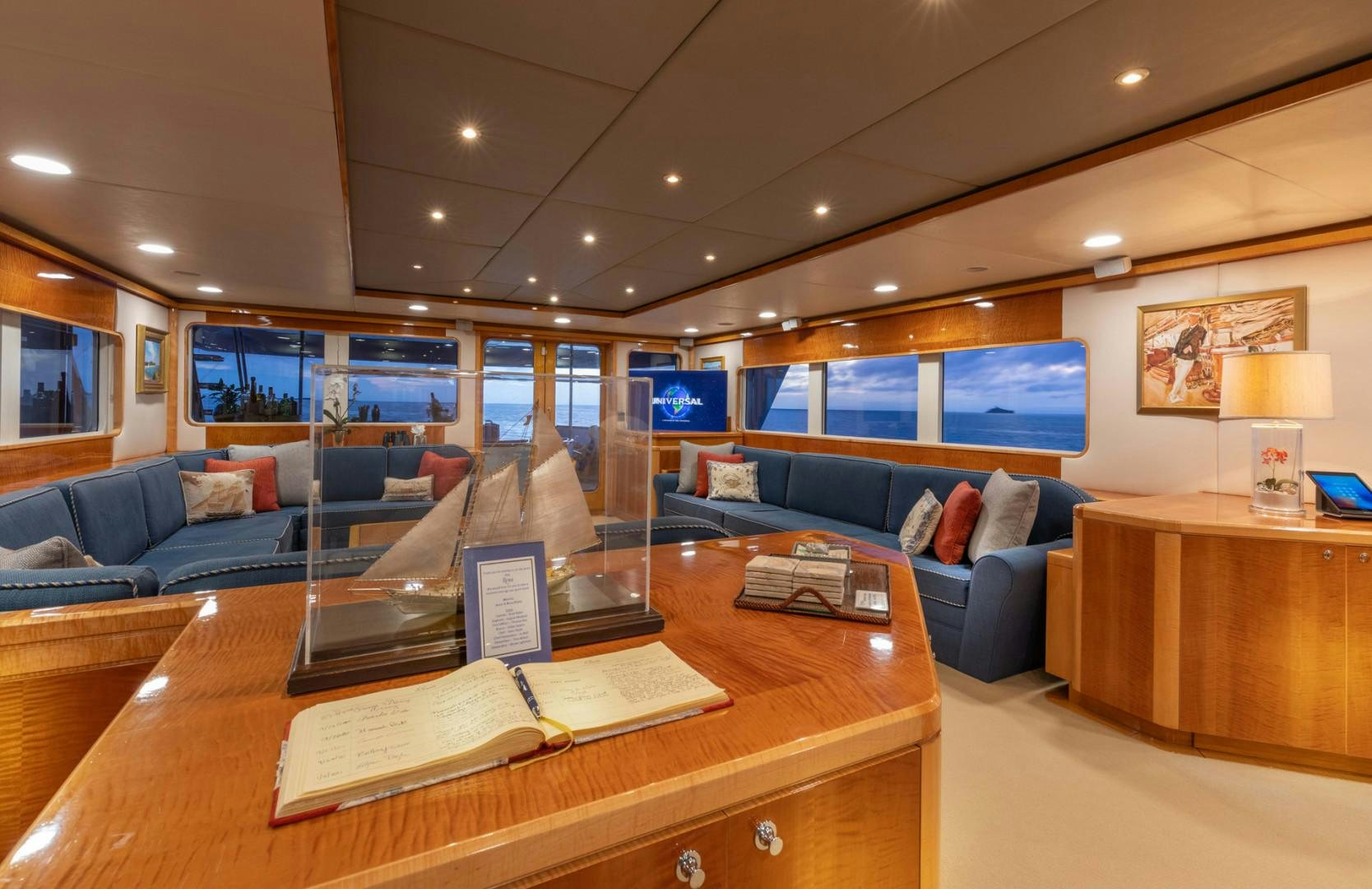 a living room with a couch and a coffee table aboard RENA Yacht for Charter