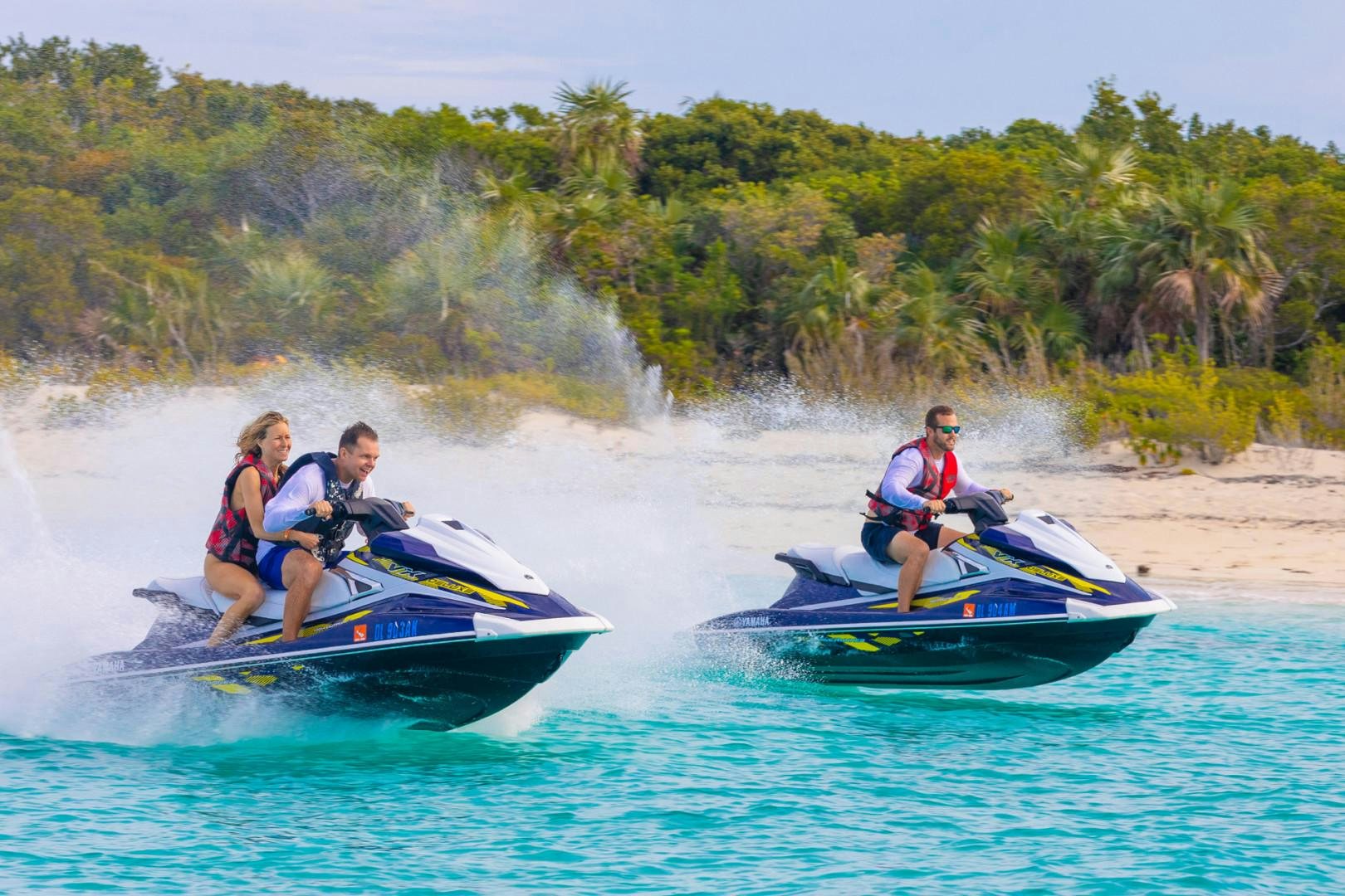 a group of people on boats in the water aboard RENA Yacht for Charter