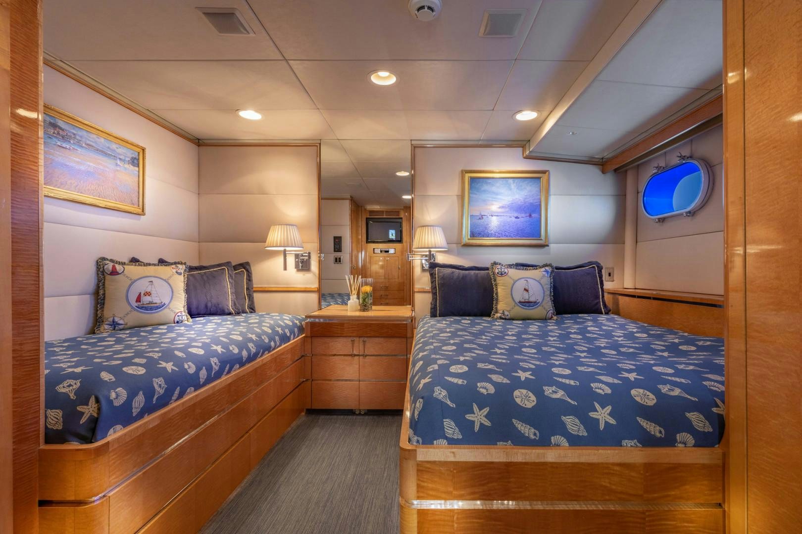 a couple of beds in a hotel room aboard RENA Yacht for Charter