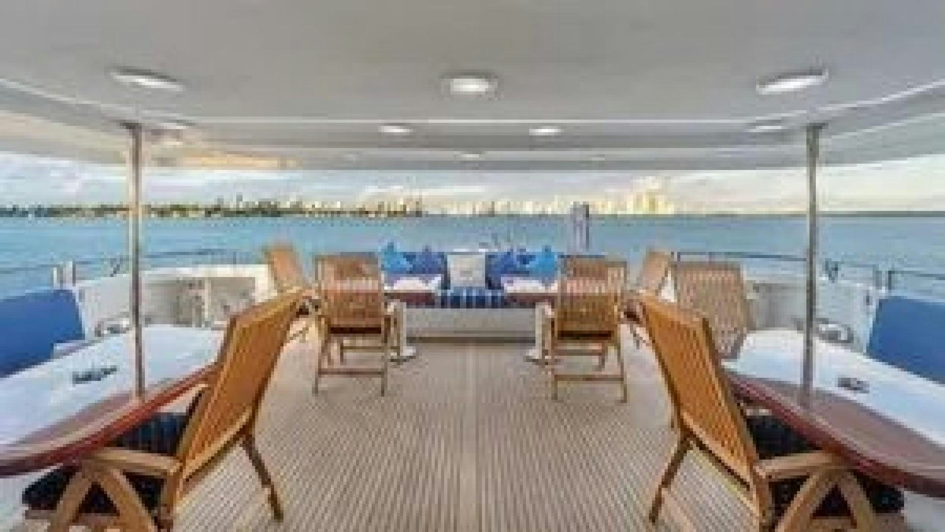 a room with chairs and tables aboard SURINA Yacht for Charter