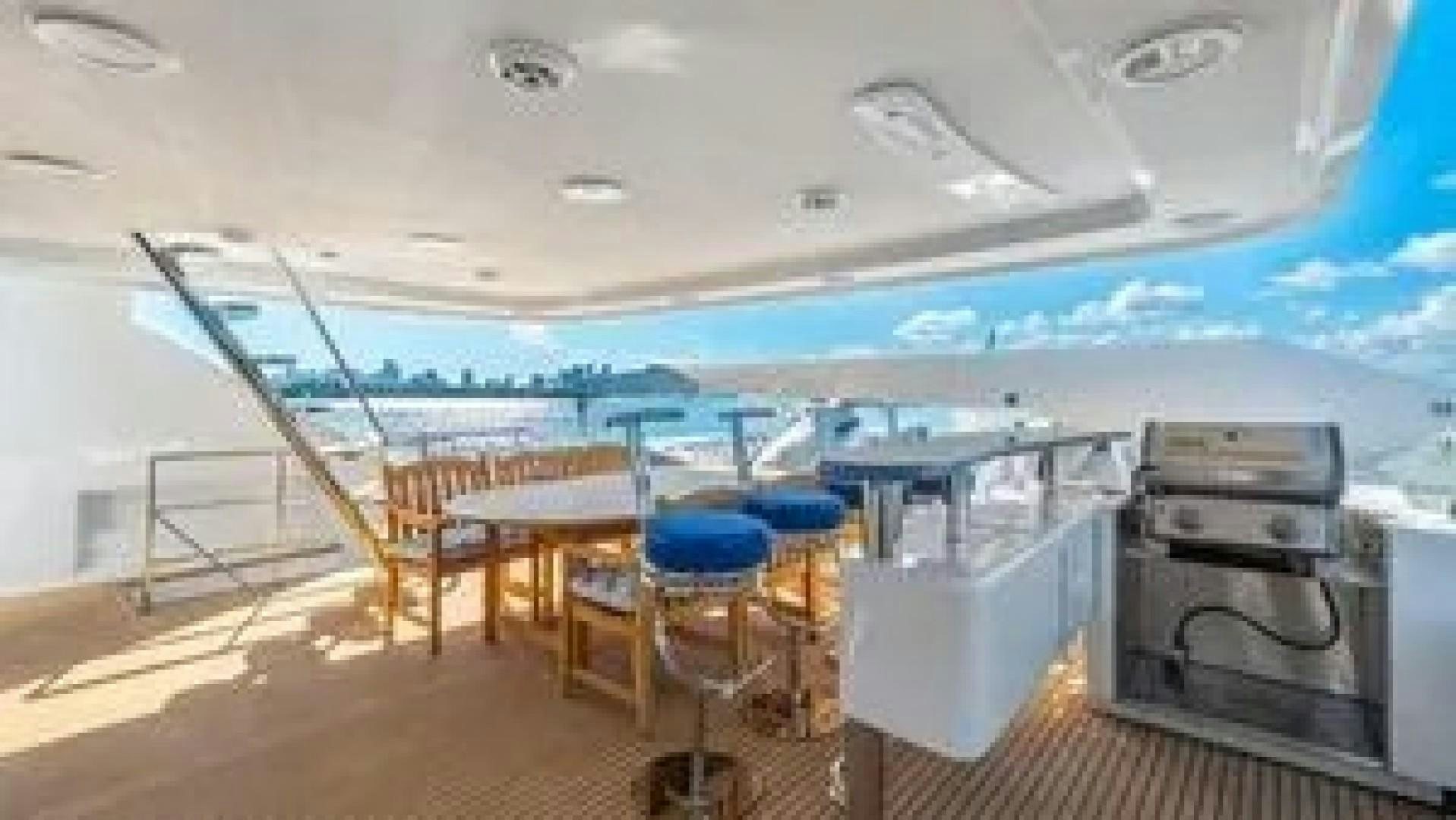 a room with a table and chairs aboard SURINA Yacht for Charter