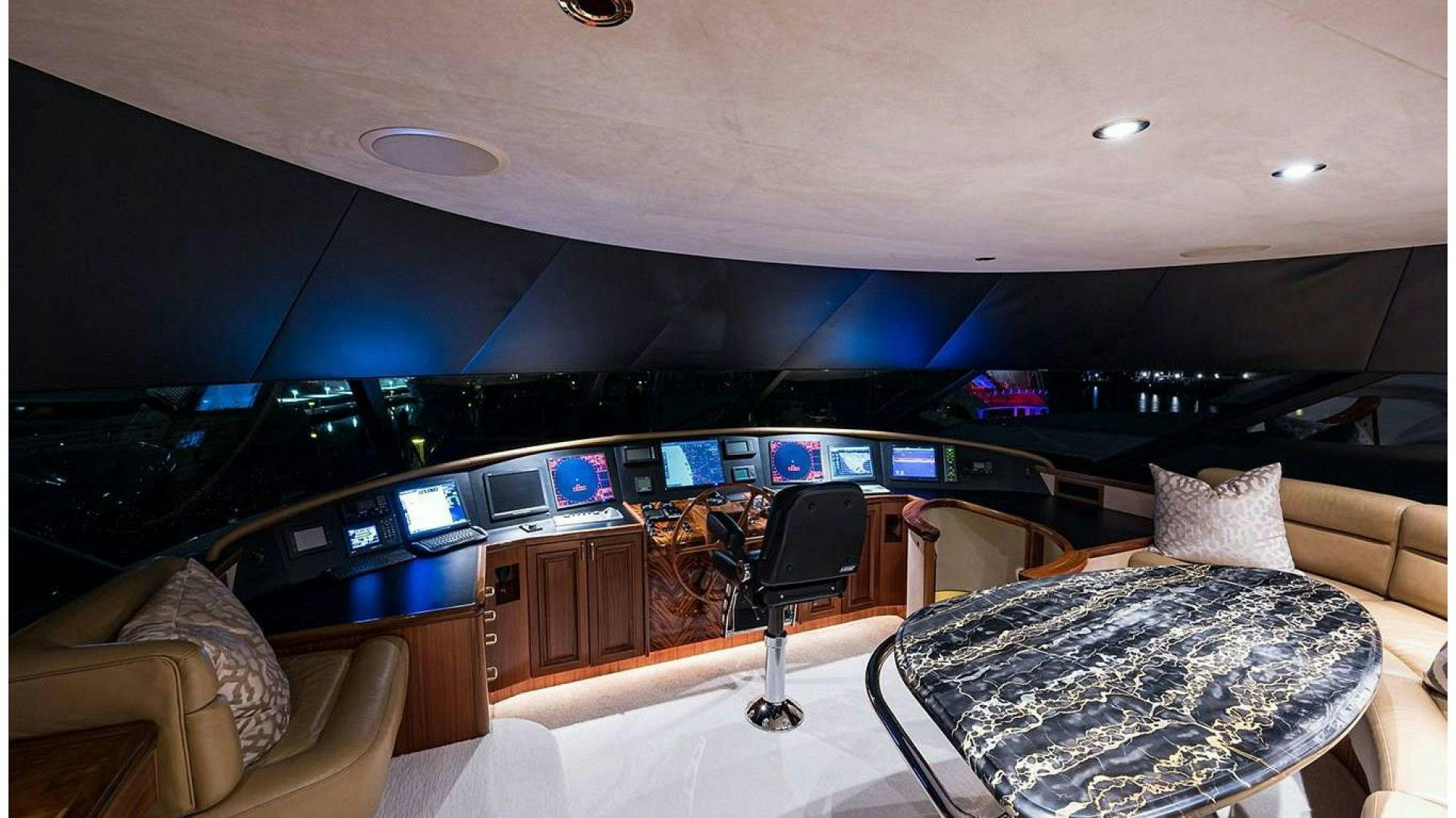a room with a couch and a television aboard NOW OR NEVER Yacht for Charter