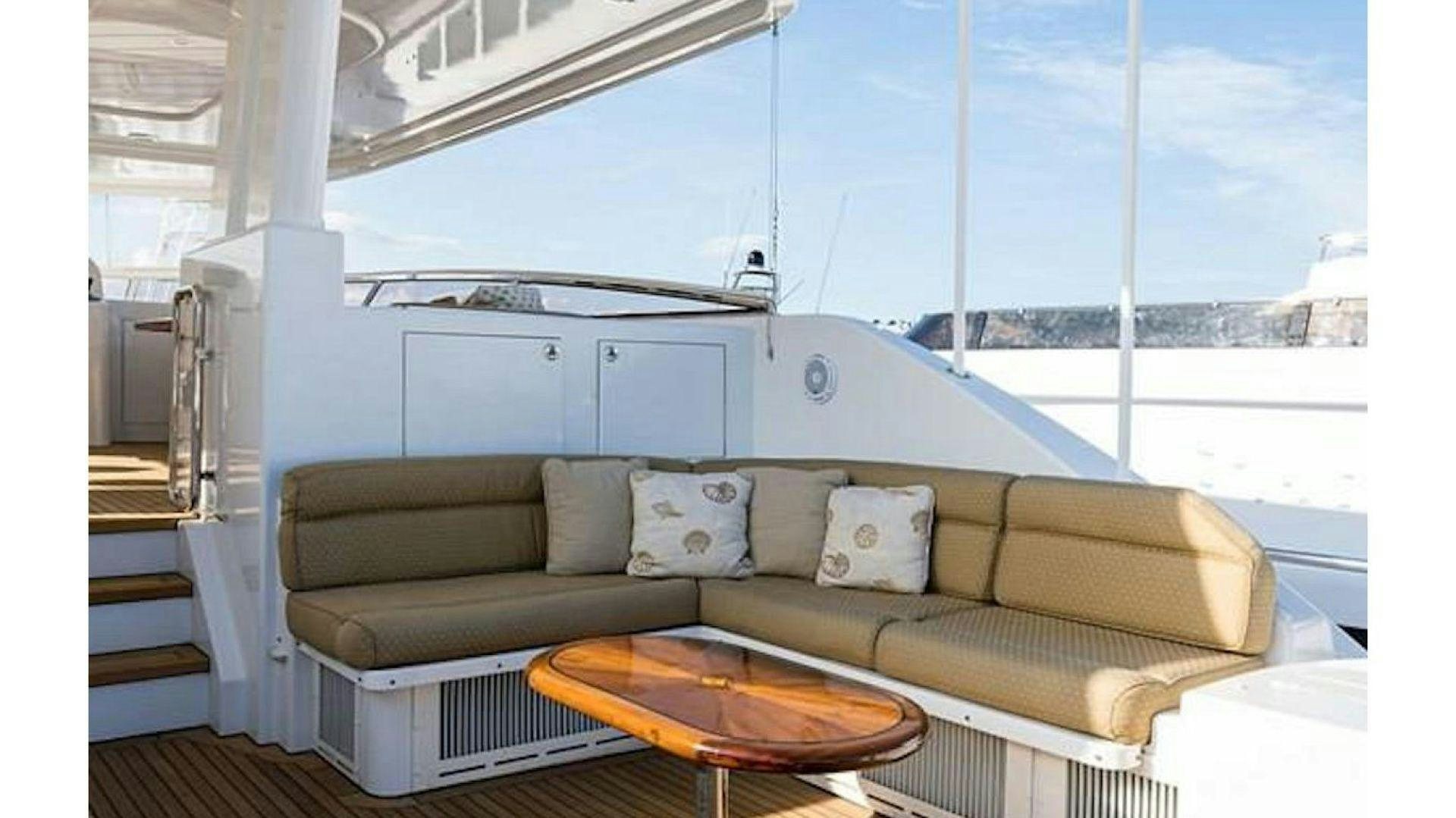 a couch on a boat aboard NOW OR NEVER Yacht for Charter