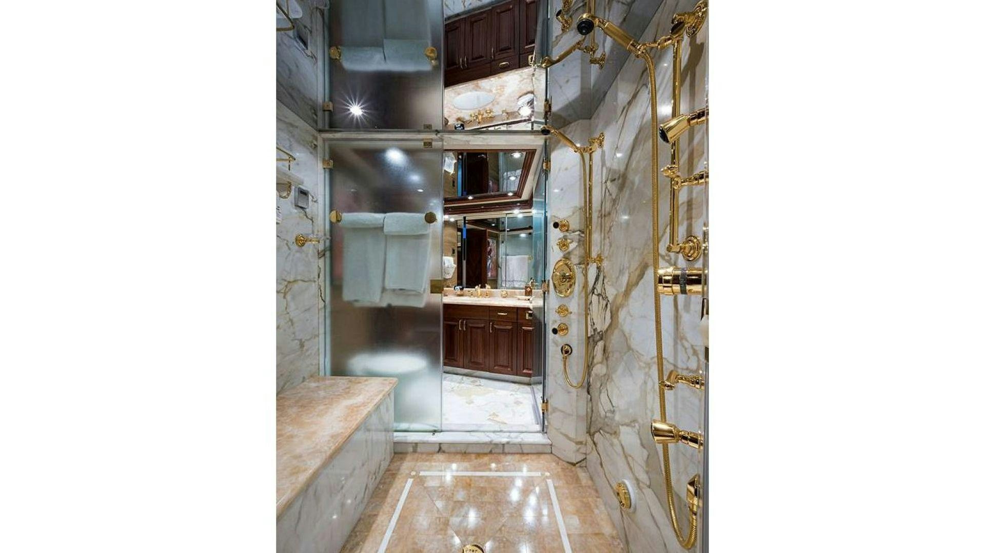 a room with a sink and a toilet aboard NOW OR NEVER Yacht for Charter