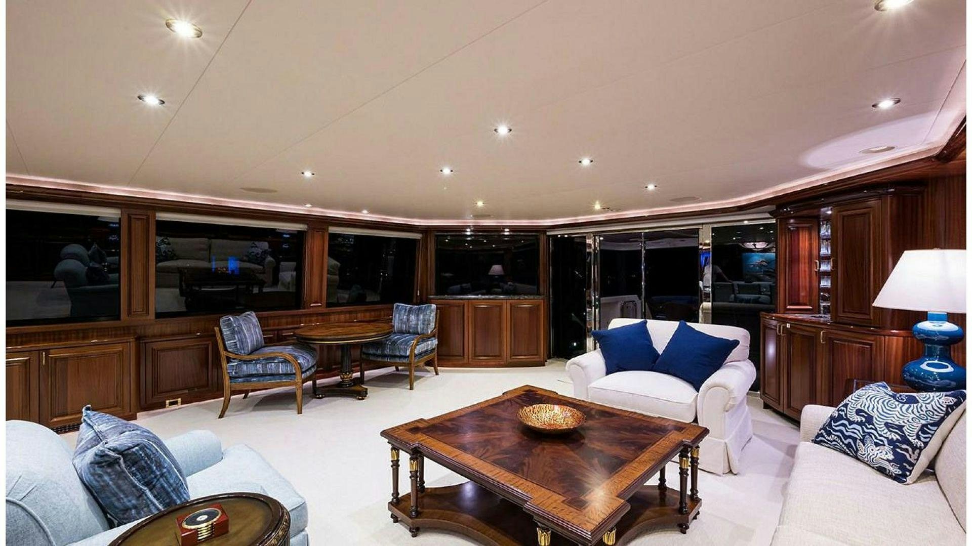 a living room with a table and chairs aboard NOW OR NEVER Yacht for Charter