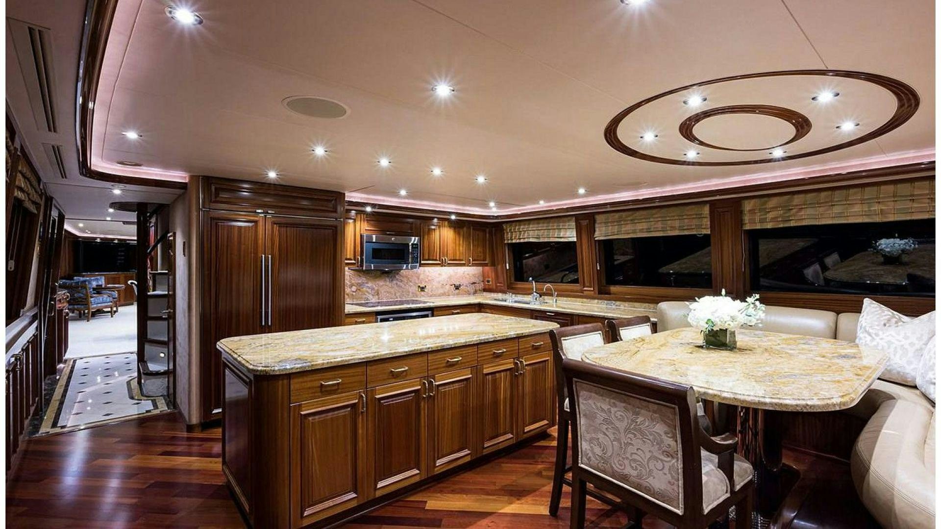 a kitchen with a dining table aboard NOW OR NEVER Yacht for Charter