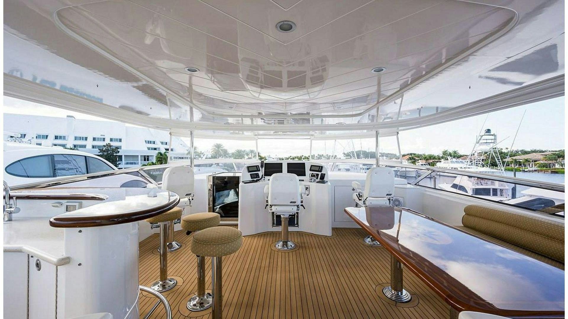 a boat with tables and chairs aboard NOW OR NEVER Yacht for Charter
