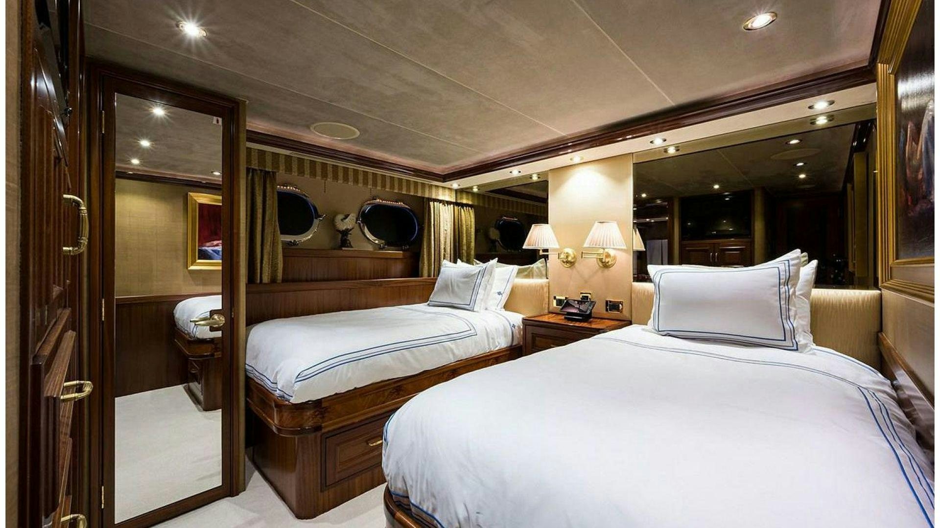 a hotel room with two beds aboard NOW OR NEVER Yacht for Charter