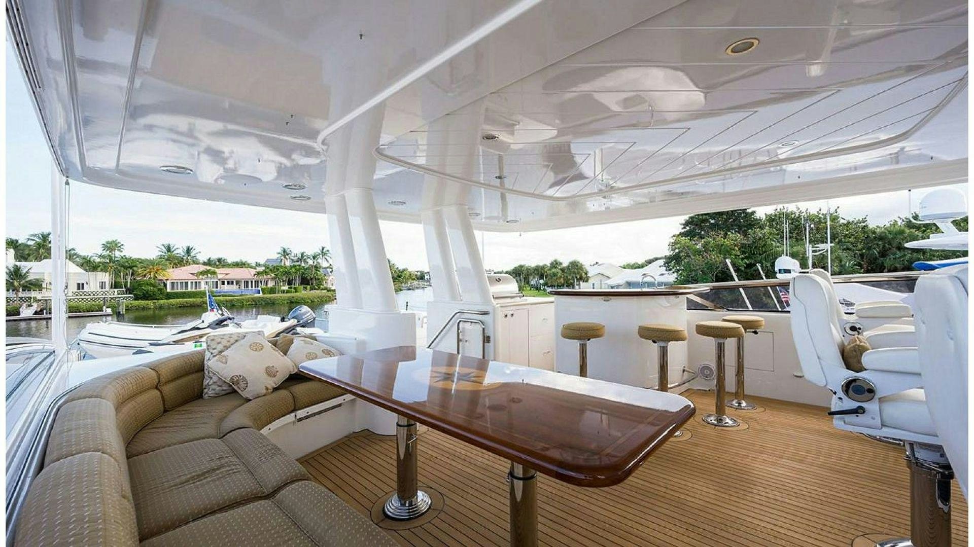 a large room with a table and chairs aboard NOW OR NEVER Yacht for Charter