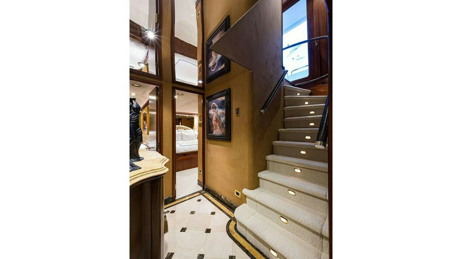 a staircase leading to a room aboard NOW OR NEVER Yacht for Charter