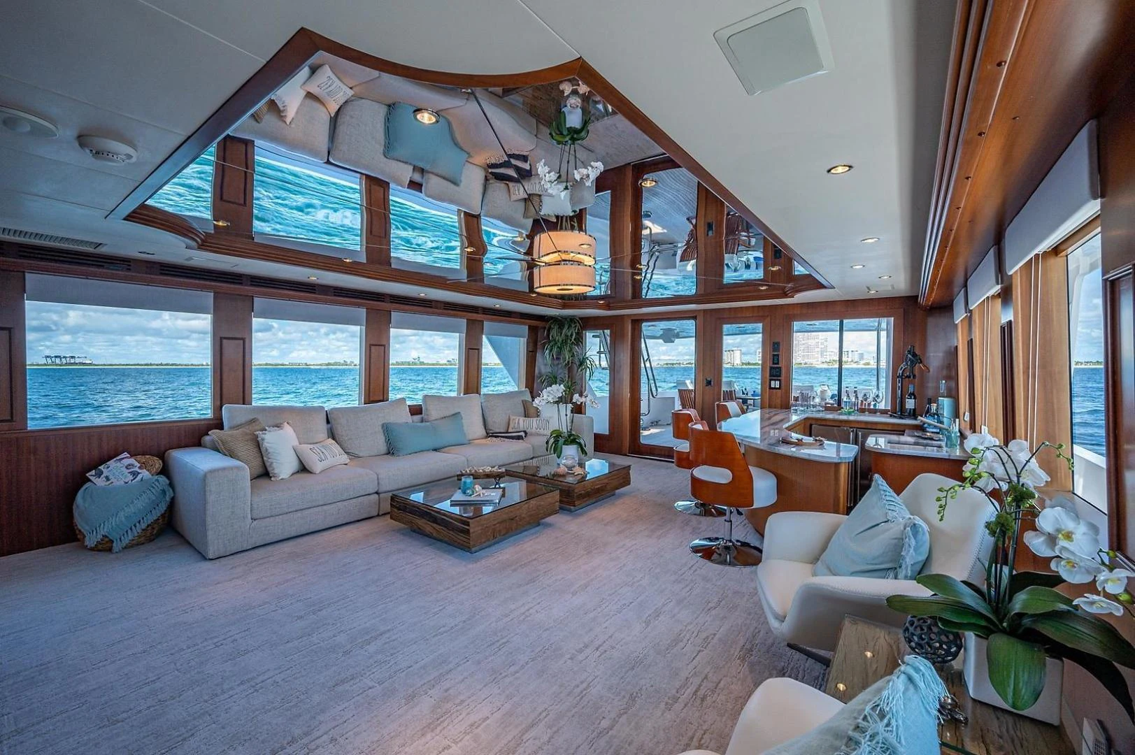 a living room with a large window aboard MAGNUM RIDE Yacht for Charter