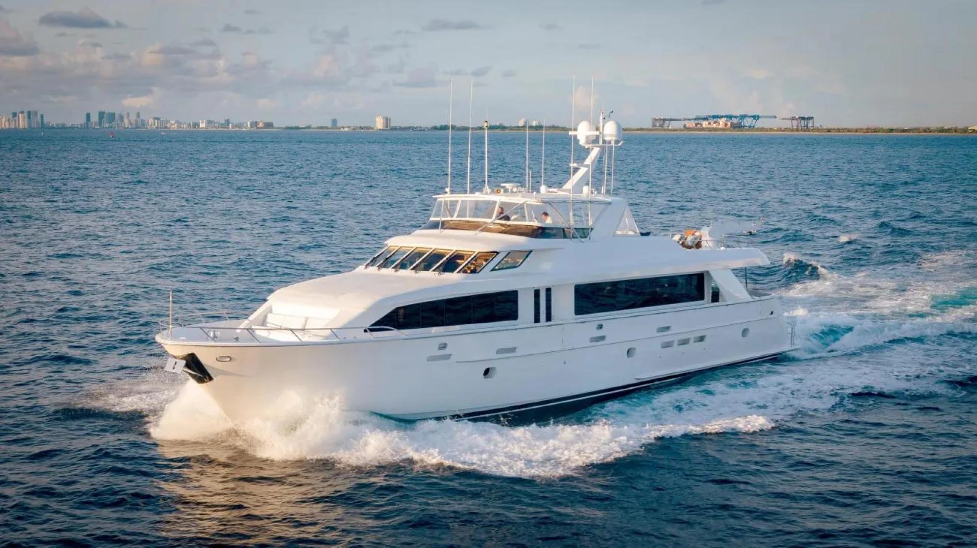 a white yacht on the water aboard MAGNUM RIDE Yacht for Charter