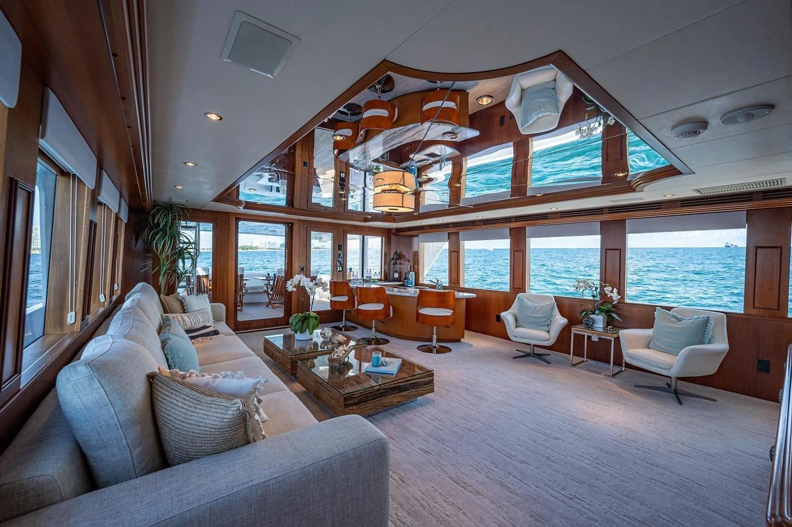 a living room with a large open window aboard MAGNUM RIDE Yacht for Charter