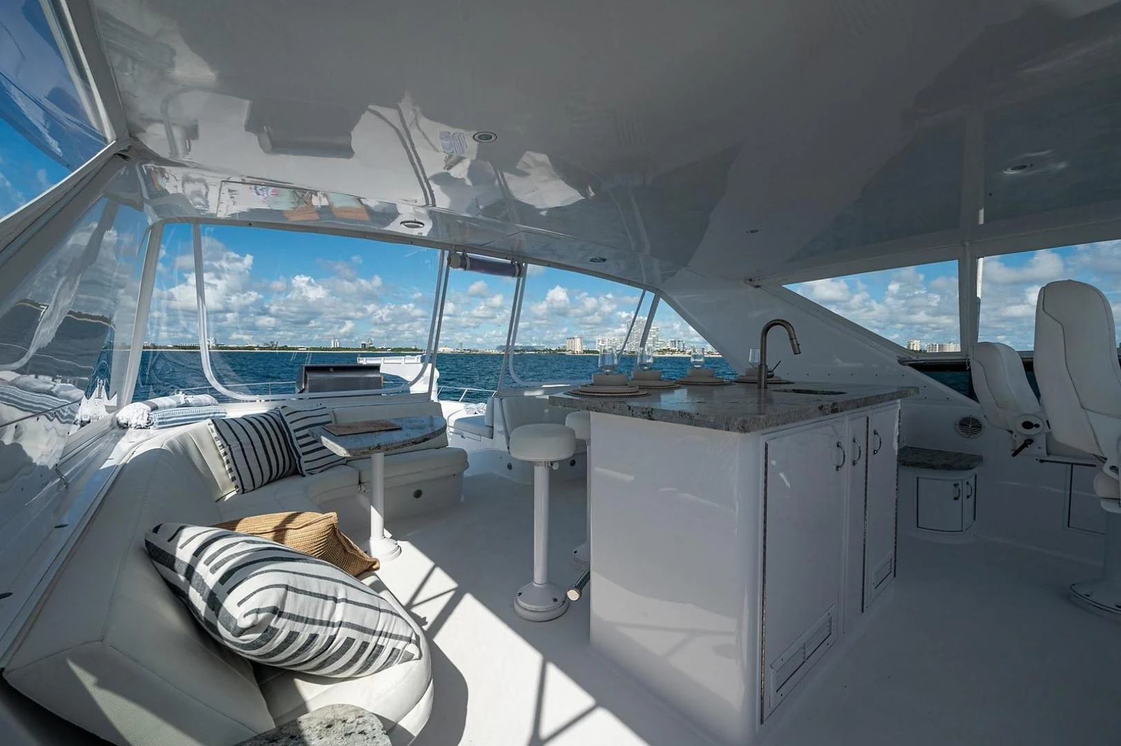 inside of a room with a large window and a bed aboard MAGNUM RIDE Yacht for Charter