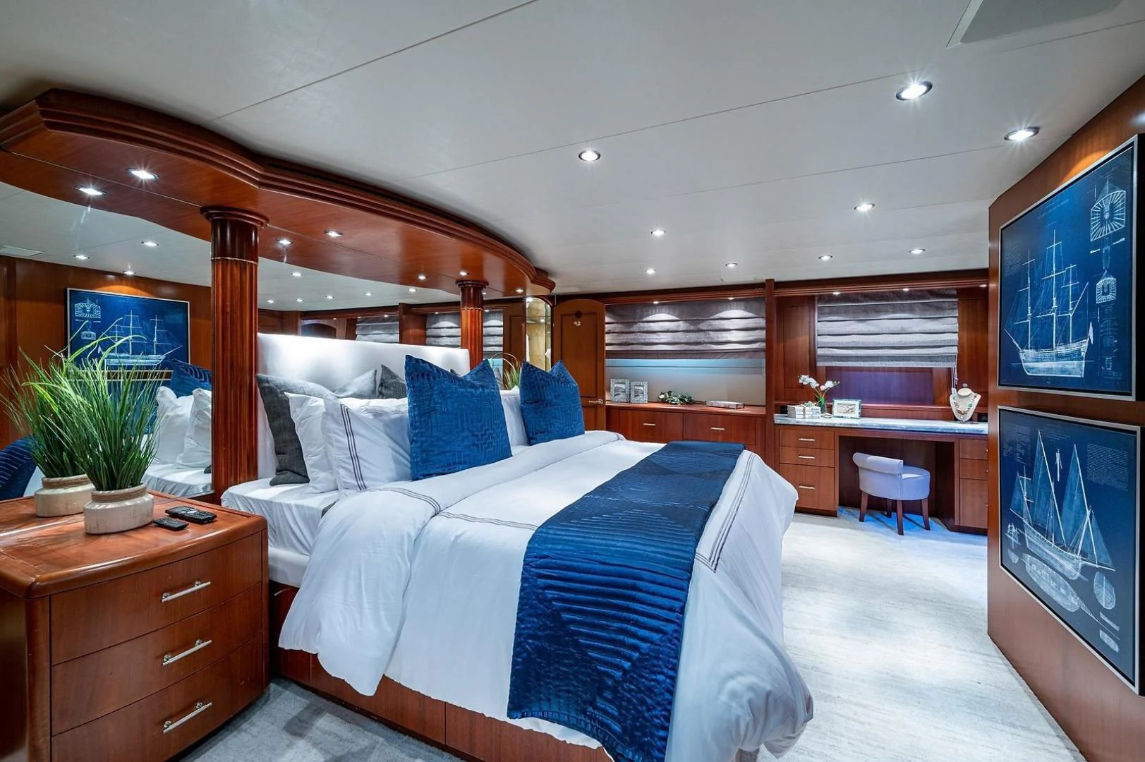 a bedroom with a bed and a desk aboard MAGNUM RIDE Yacht for Charter