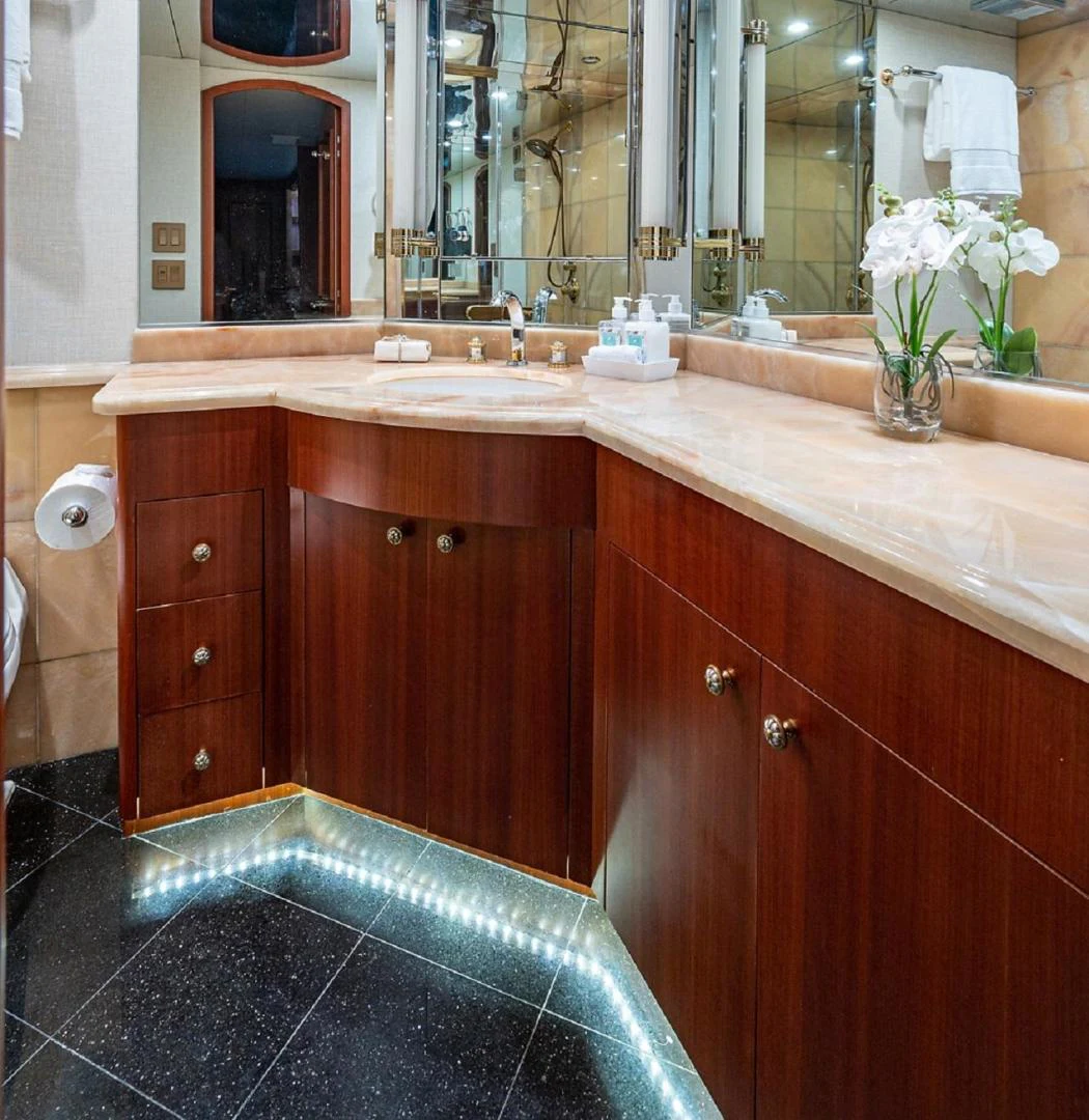 a bathroom with a sink and a mirror aboard MAGNUM RIDE Yacht for Charter