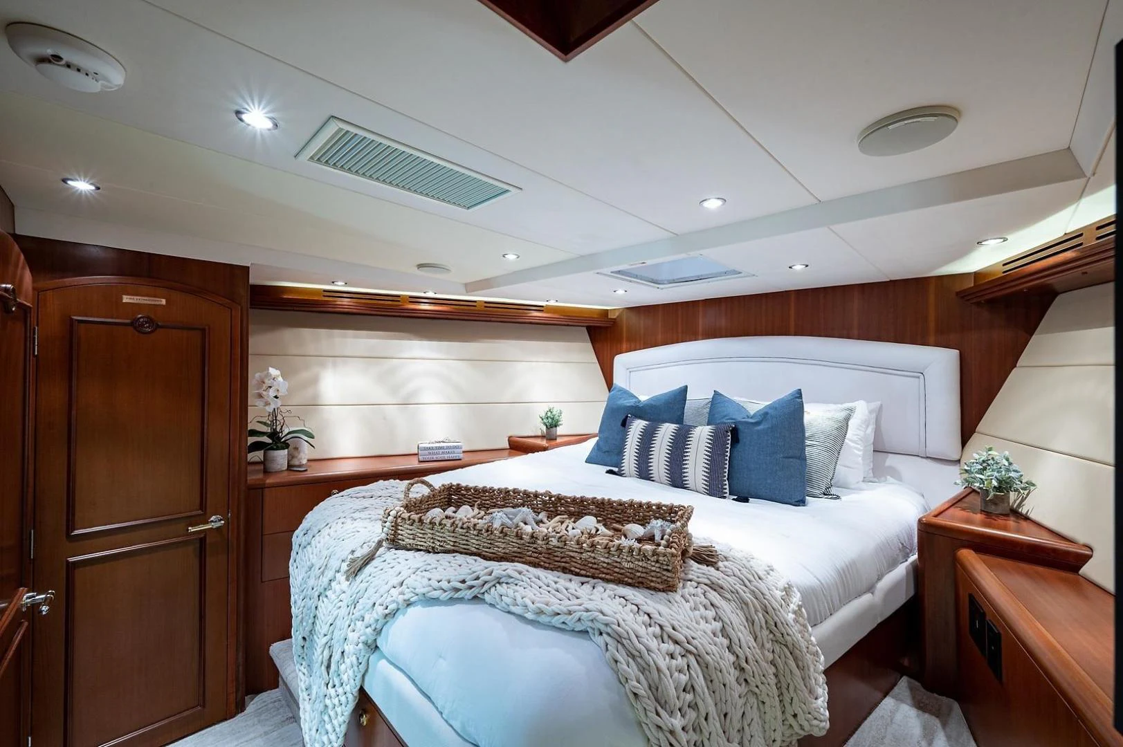 a bedroom with a bed and a desk aboard MAGNUM RIDE Yacht for Charter
