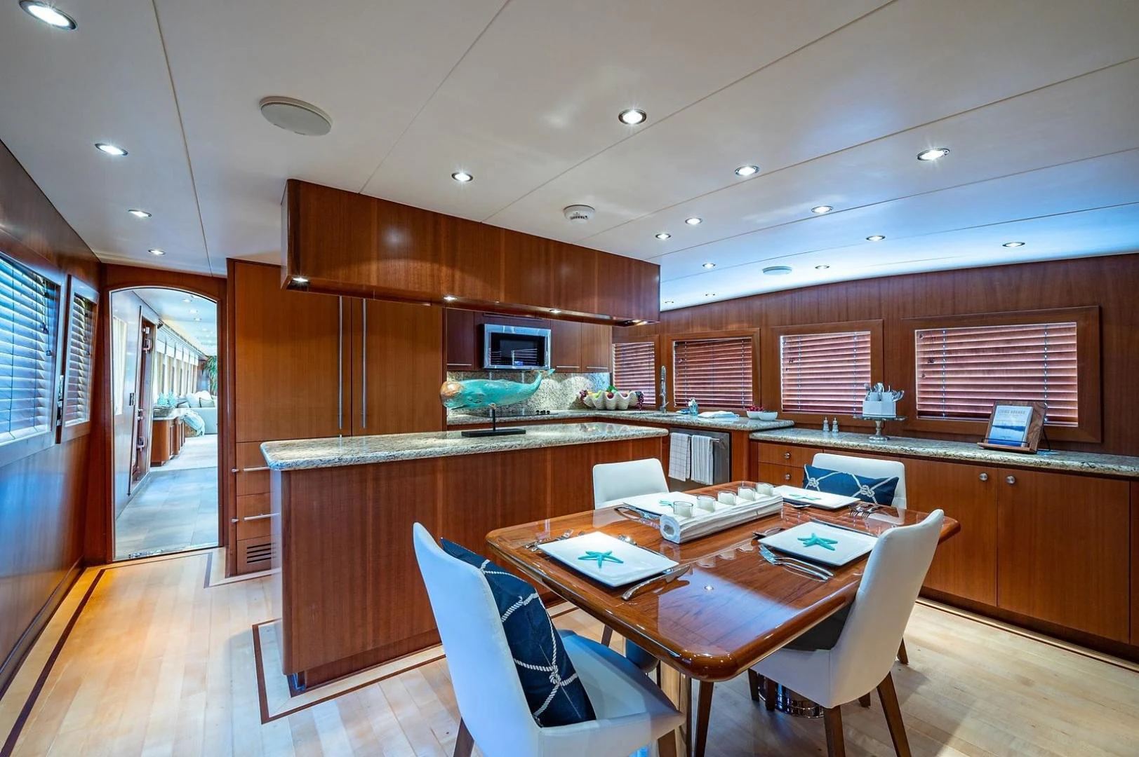a room with a table and chairs aboard MAGNUM RIDE Yacht for Charter