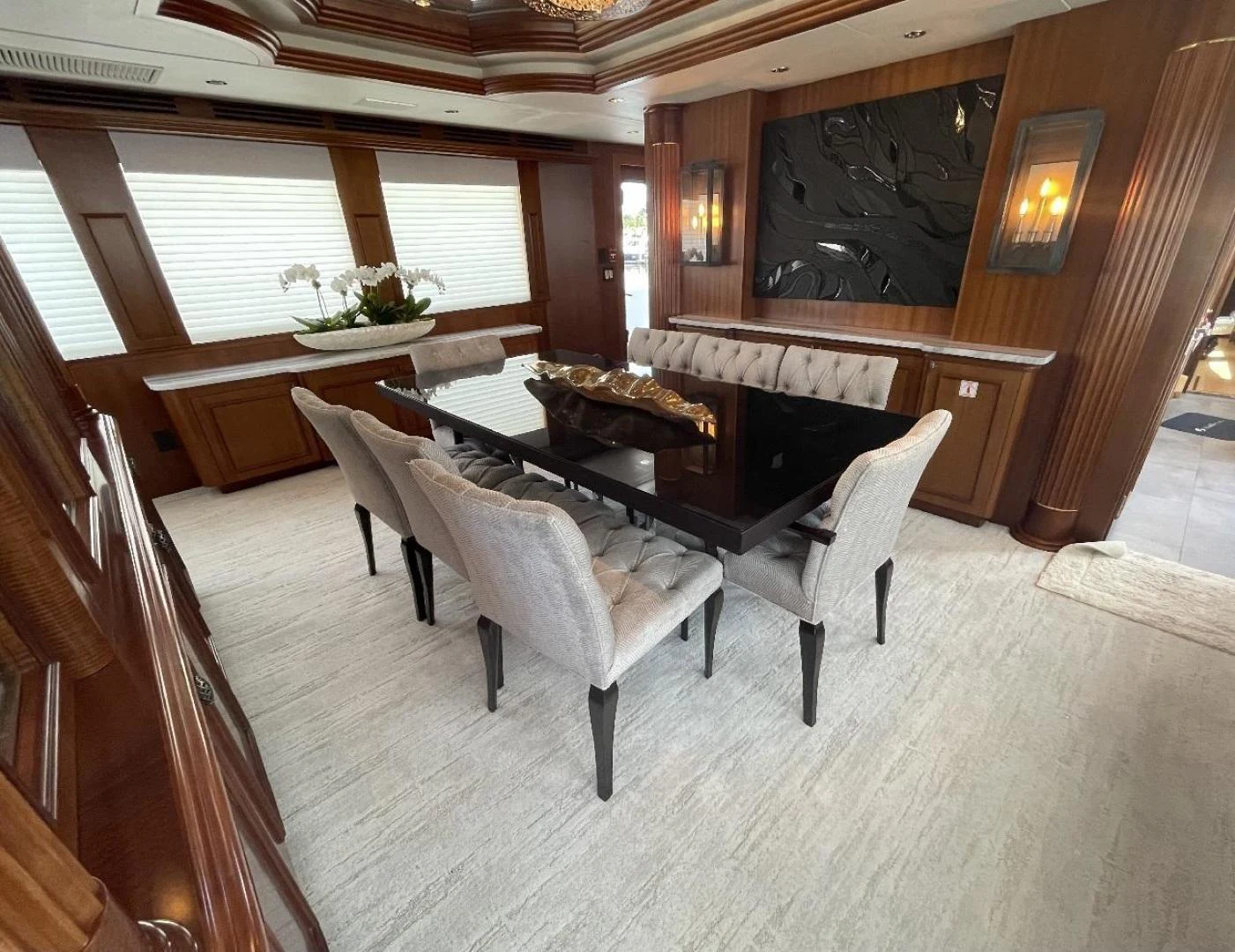 a room with a table and chairs aboard MAGNUM RIDE Yacht for Charter