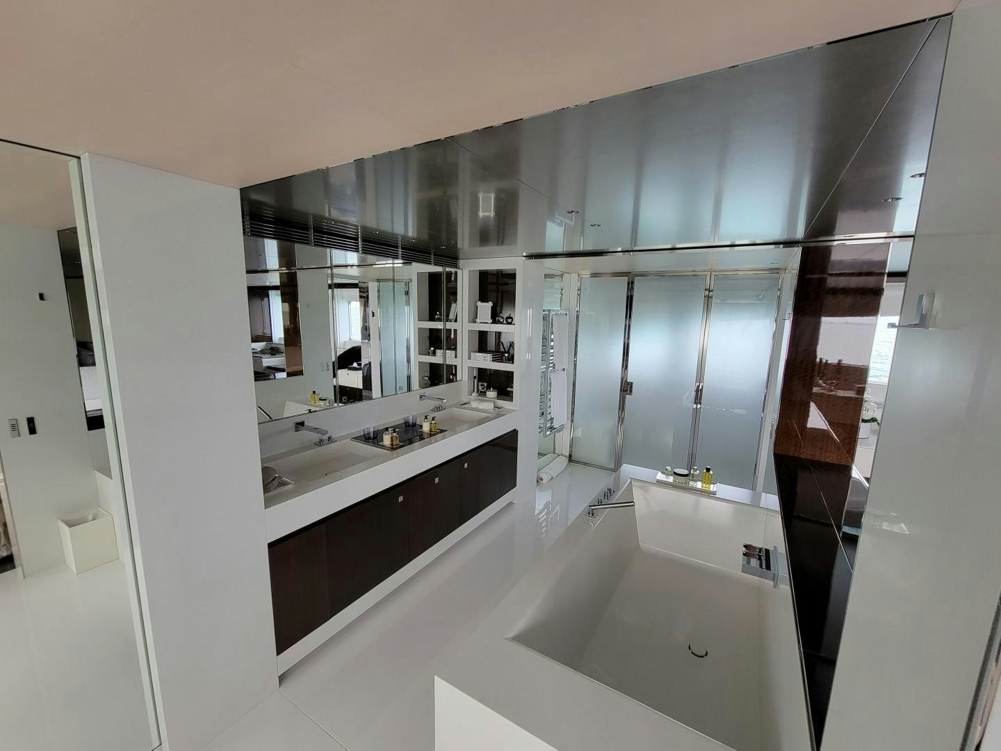 a bathroom with a large mirror aboard KNIGHT Yacht for Charter