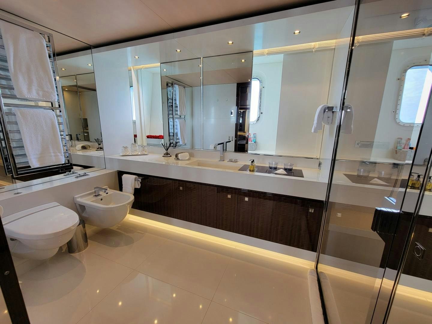 a bathroom with a large mirror aboard KNIGHT Yacht for Charter