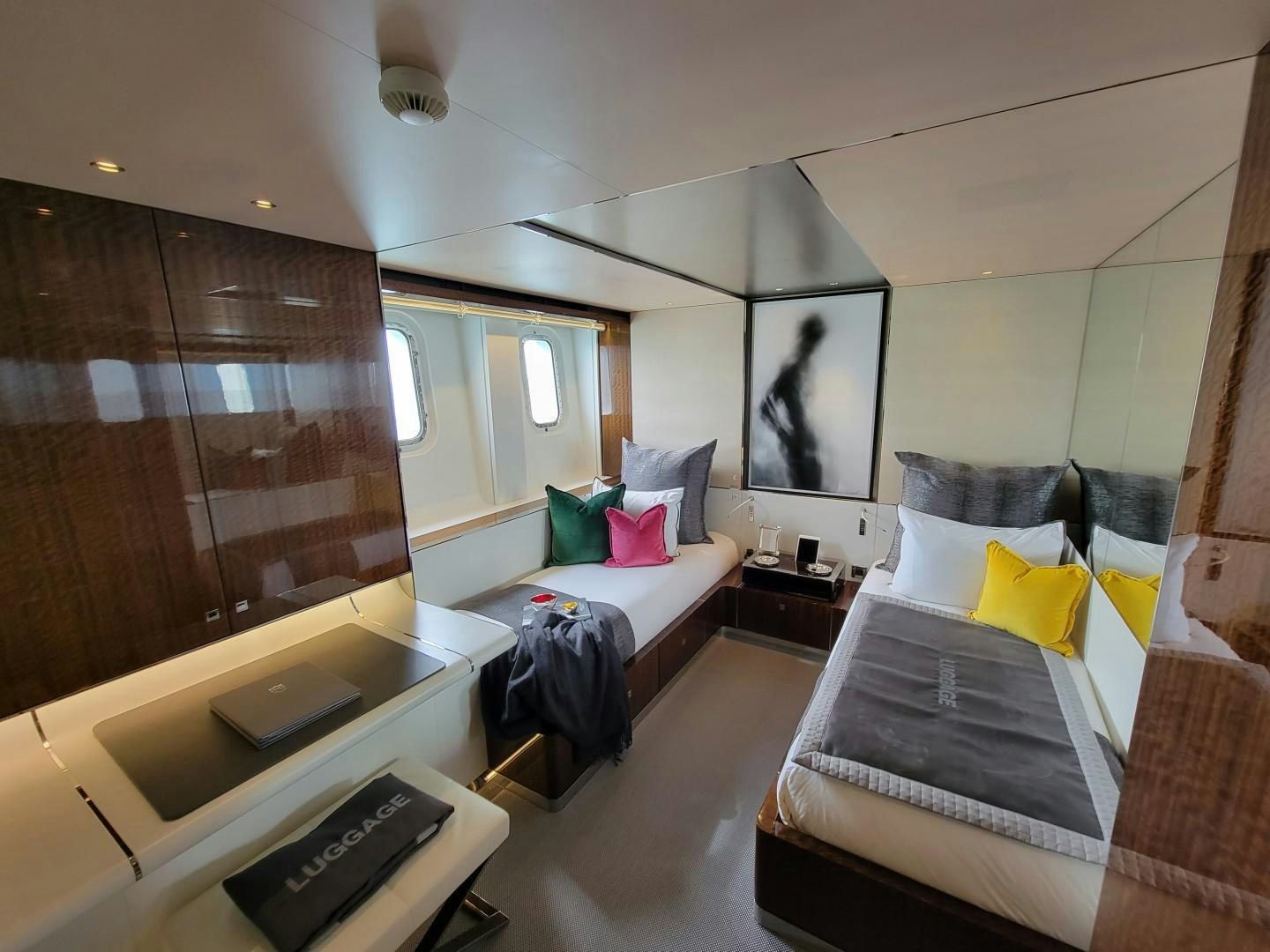 a bedroom with a bed and a television aboard KNIGHT Yacht for Charter