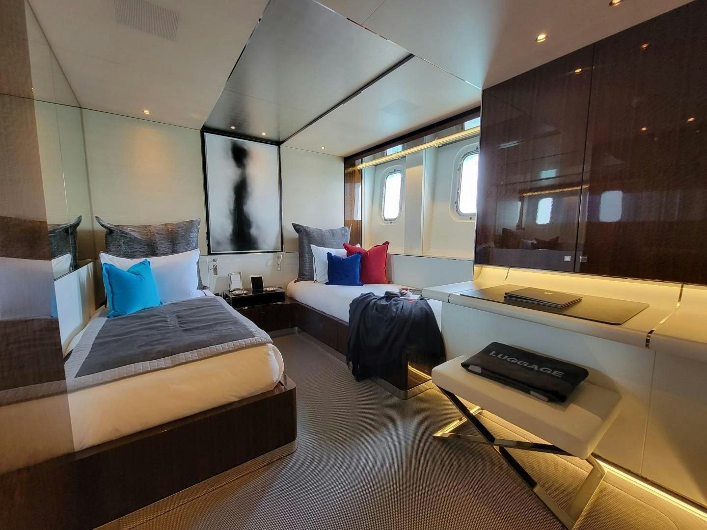 a room with a bed and a desk aboard KNIGHT Yacht for Charter