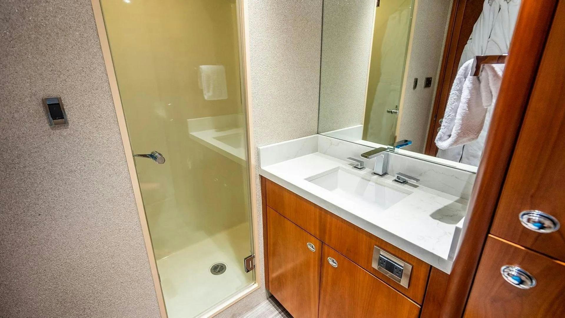 a bathroom with a sink and a mirror aboard KEMOSABE Yacht for Charter