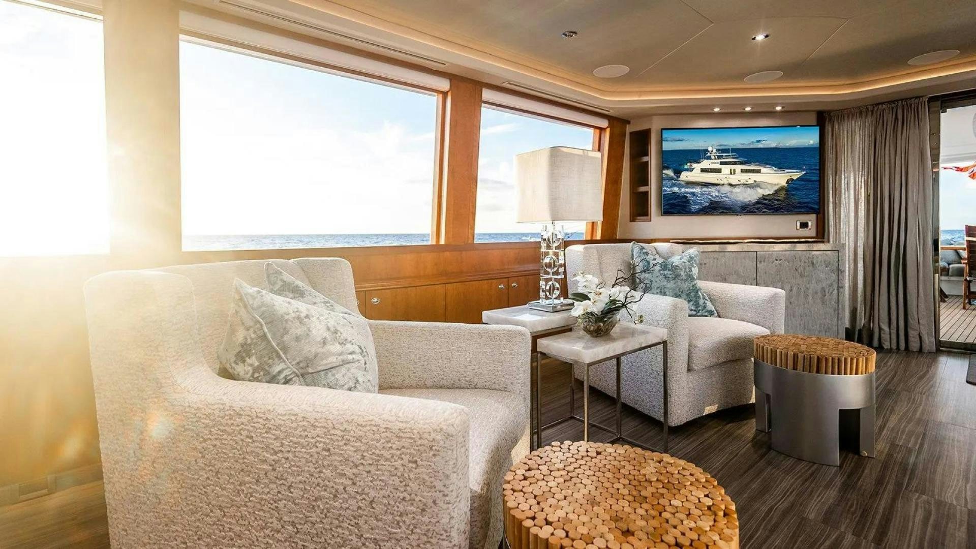 a living room with a couch and a table aboard KEMOSABE Yacht for Charter