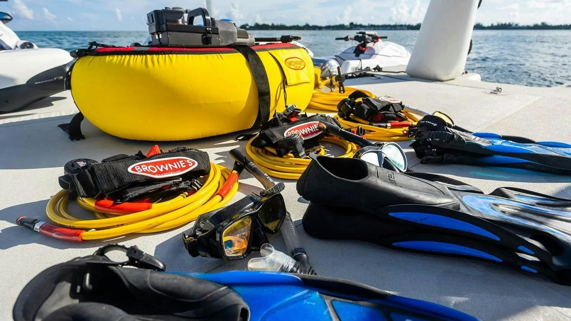 a group of kayaks on a beach aboard KEMOSABE Yacht for Charter