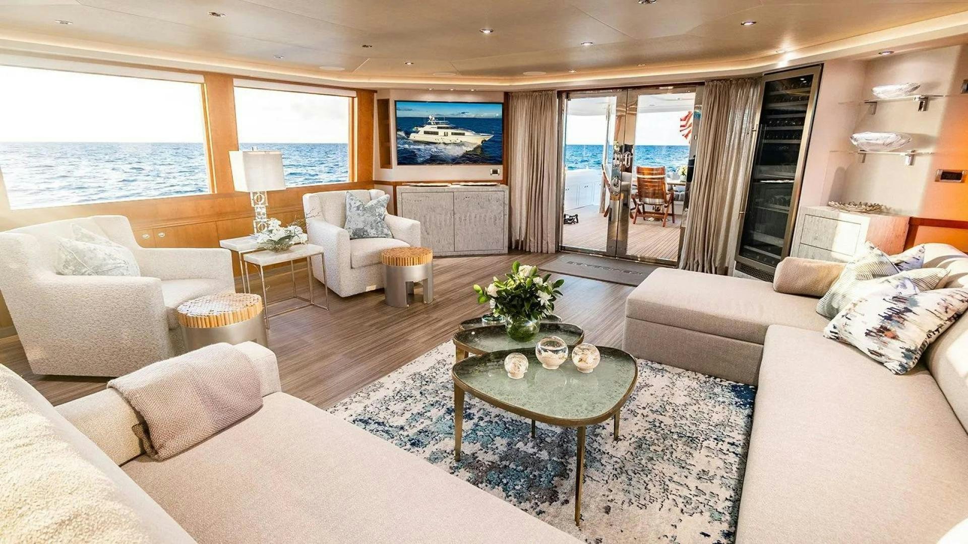 a living room with a large window aboard KEMOSABE Yacht for Charter