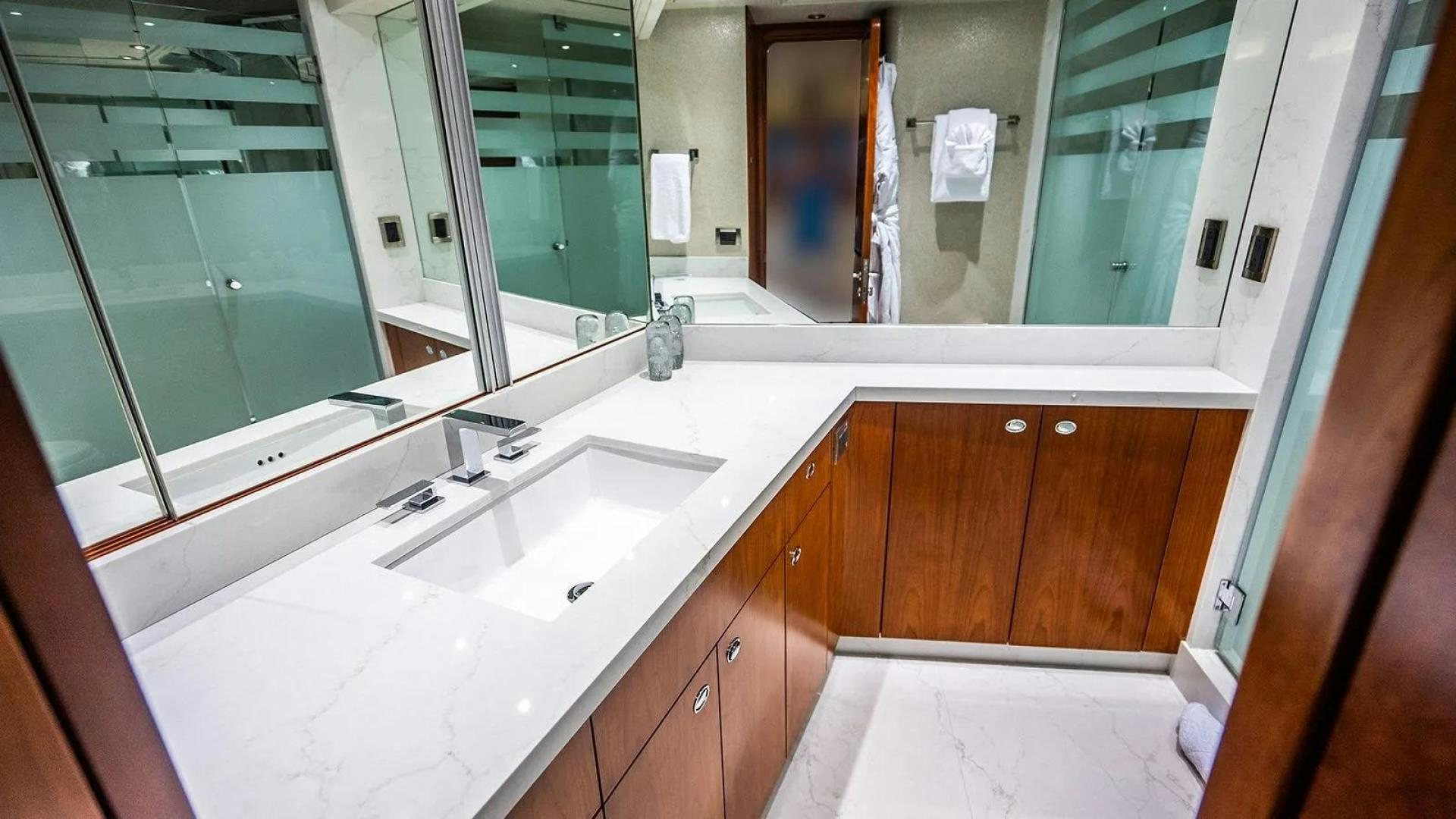 a bathroom with a large mirror aboard KEMOSABE Yacht for Charter