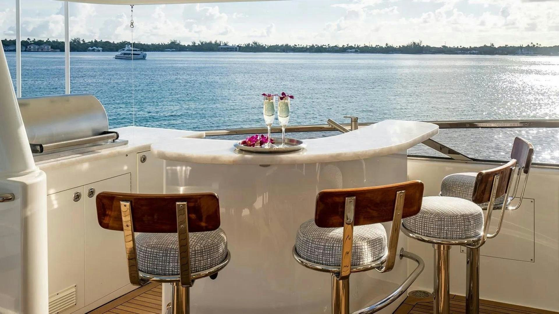 a table and chairs on a boat aboard KEMOSABE Yacht for Charter