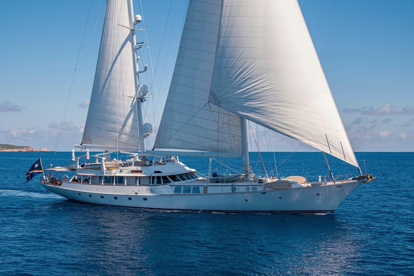 a white boat on the water aboard MIKADO Yacht for Sale