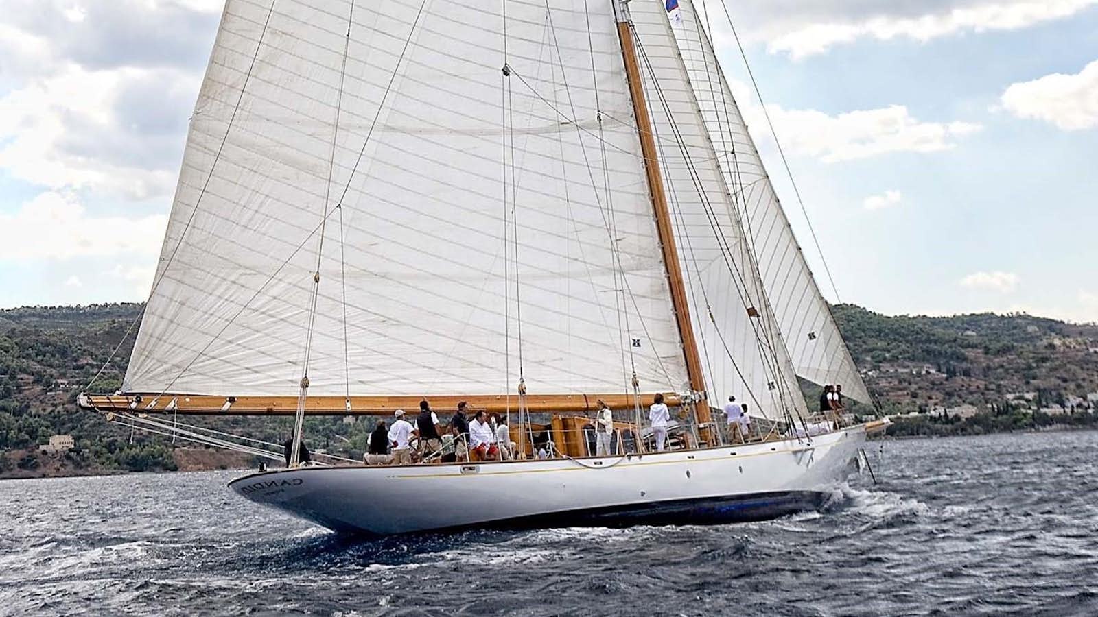 a sailboat with people on it aboard CANDIDA Yacht for Sale