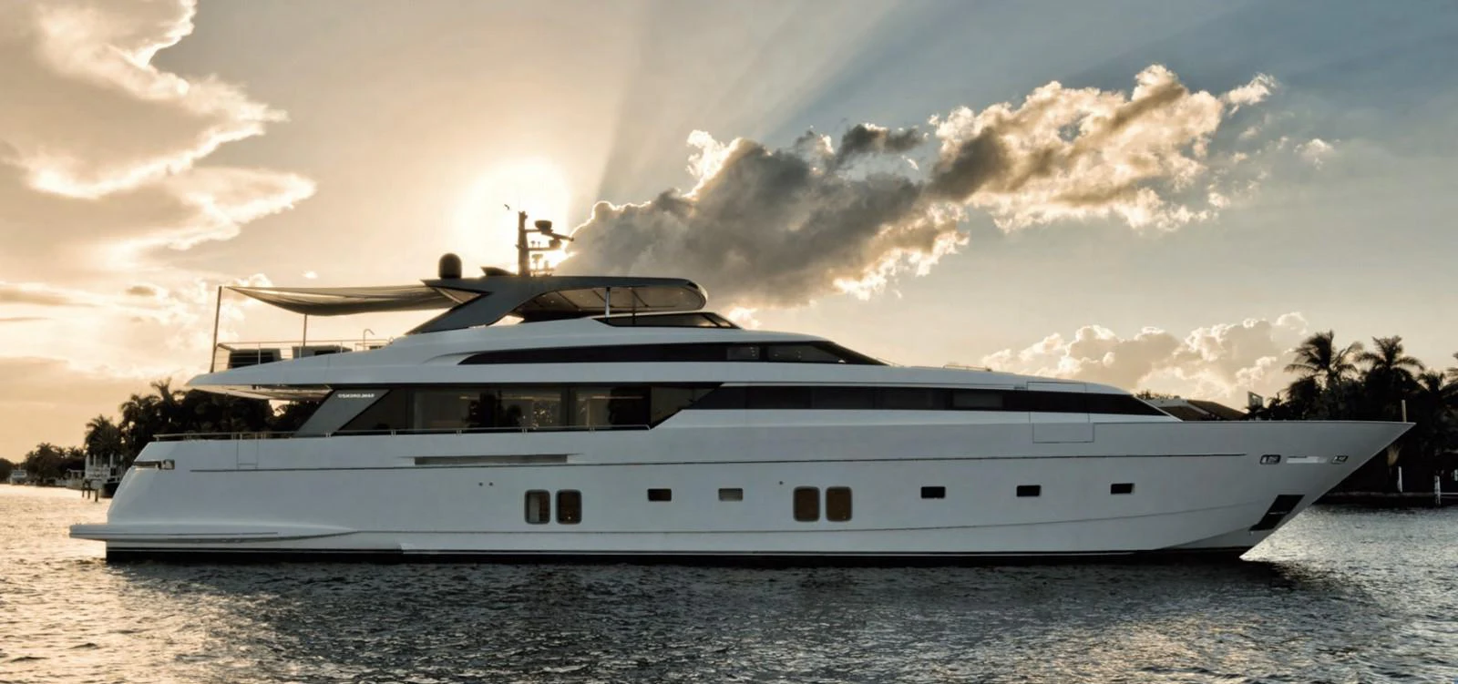 a white yacht on the beach aboard TOUTE SWEET Yacht for Sale