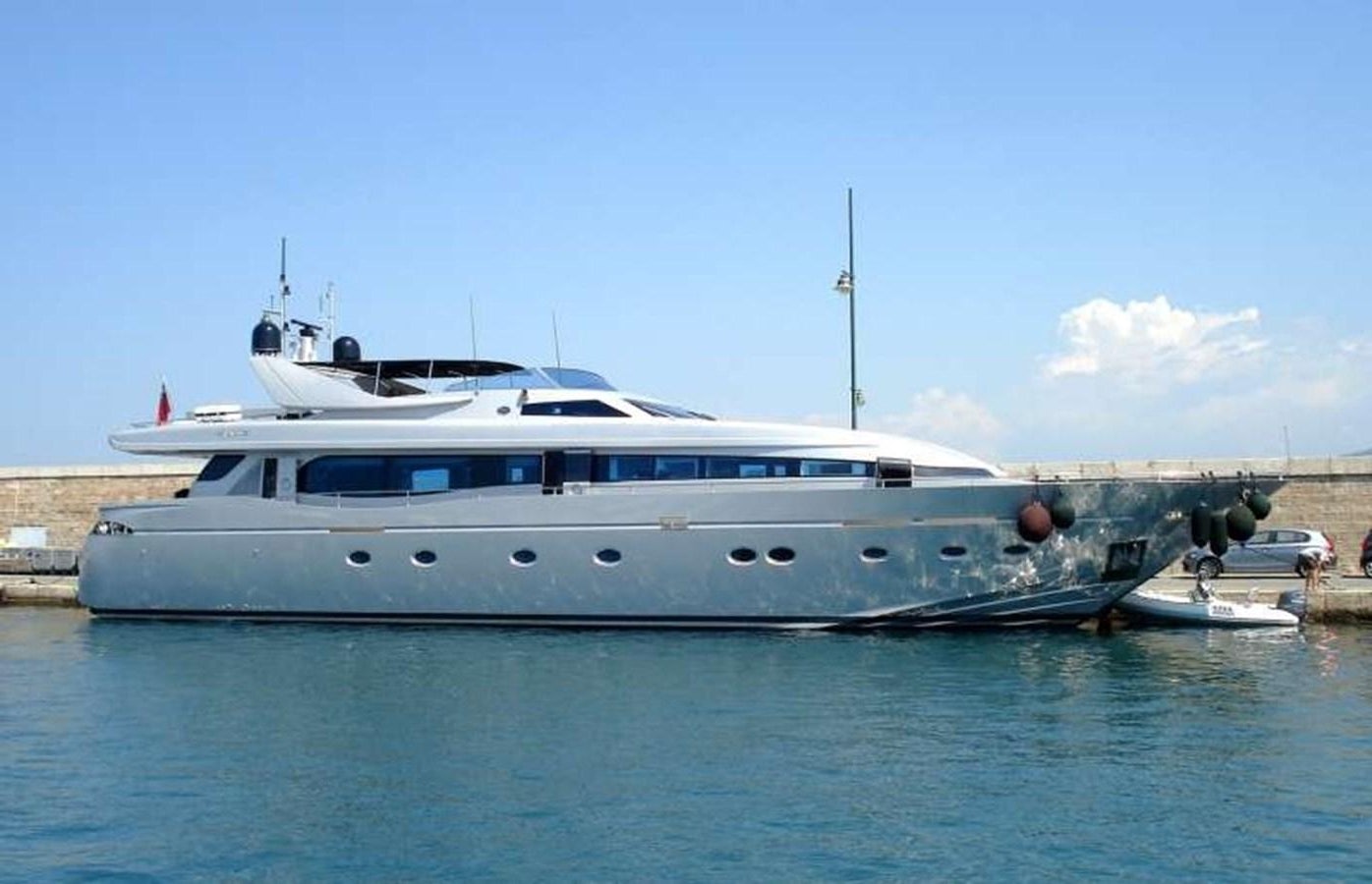 a large white boat in a body of water aboard NAUGHTY BY NATURE Yacht for Sale