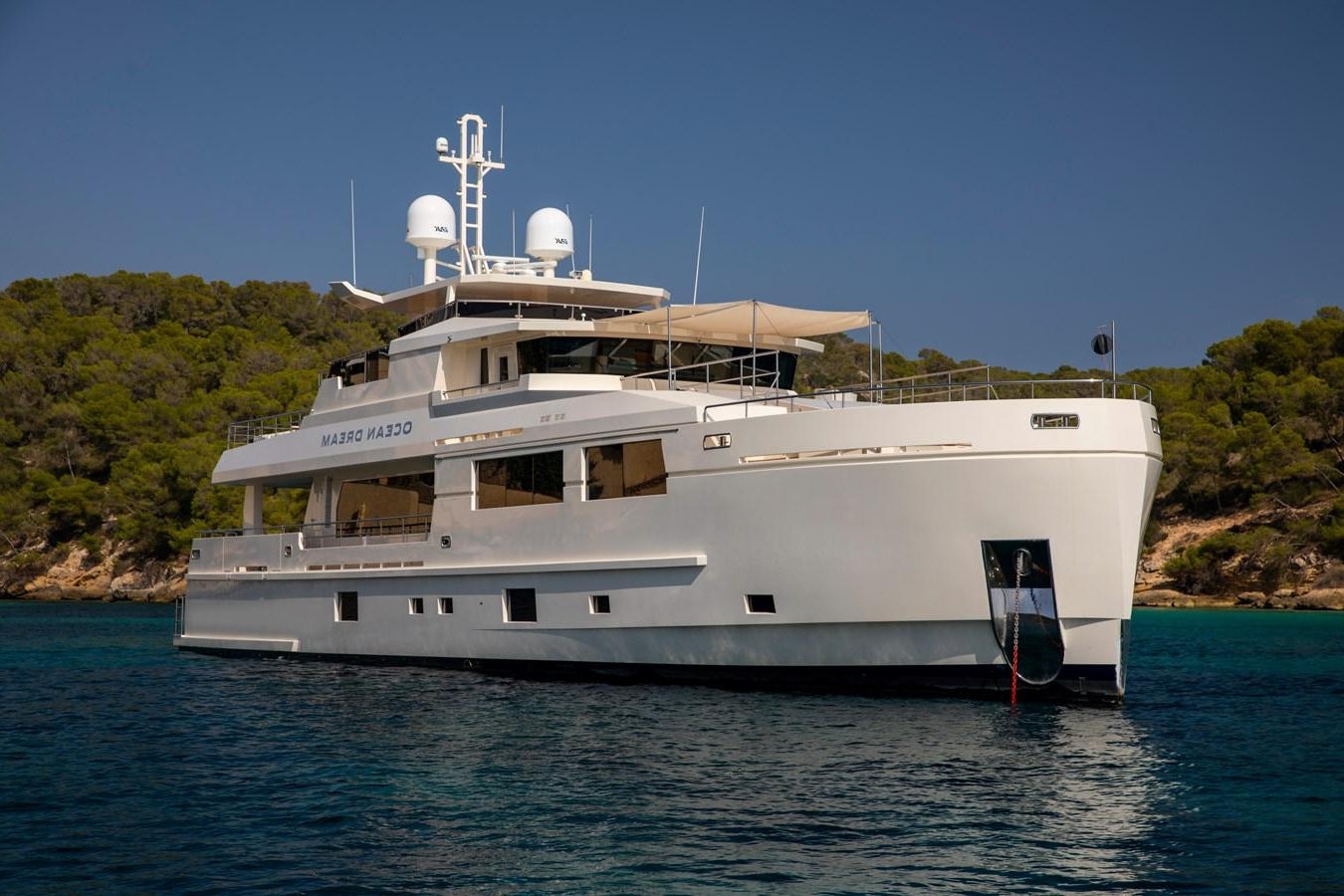 a large white boat in the water aboard OCEAN DREAM Yacht for Sale