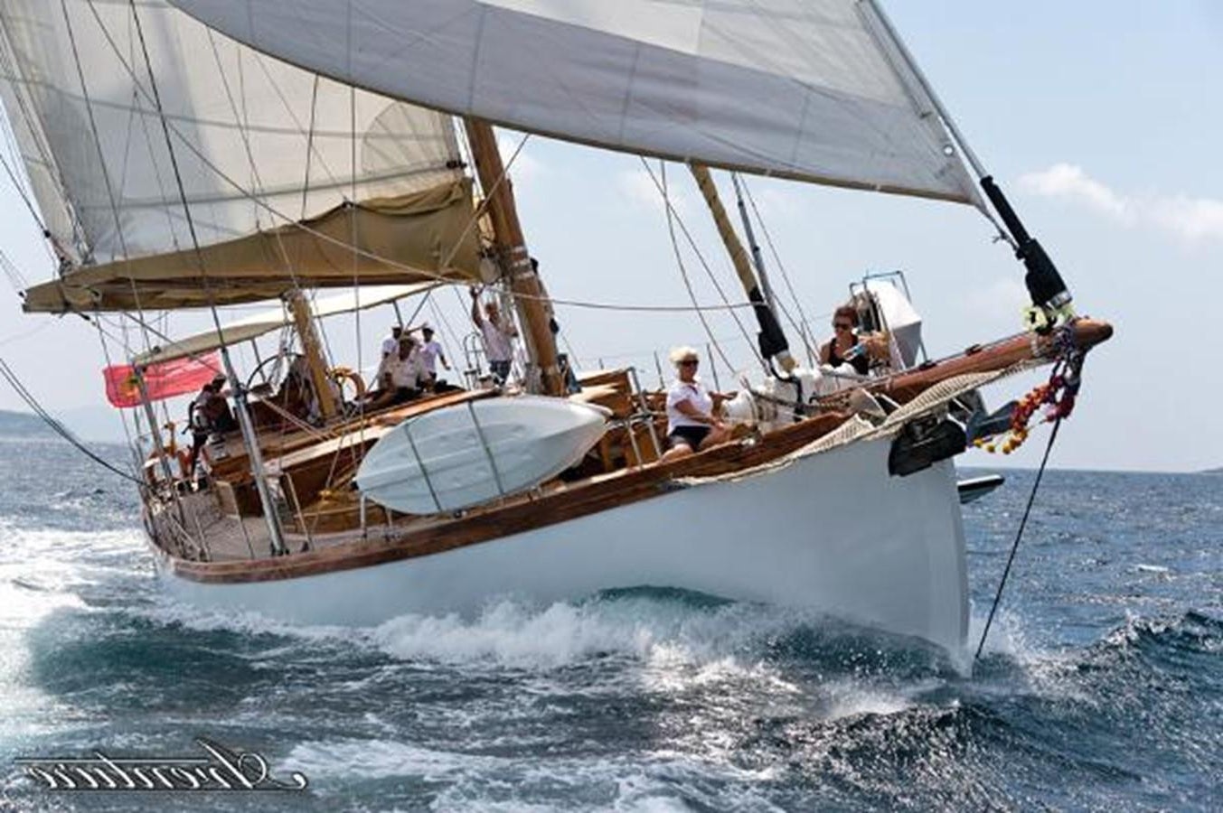 a group of people on a sailboat aboard 95FT 2011 CUSTOM KETCH CLASSIC YACHT Yacht for Sale