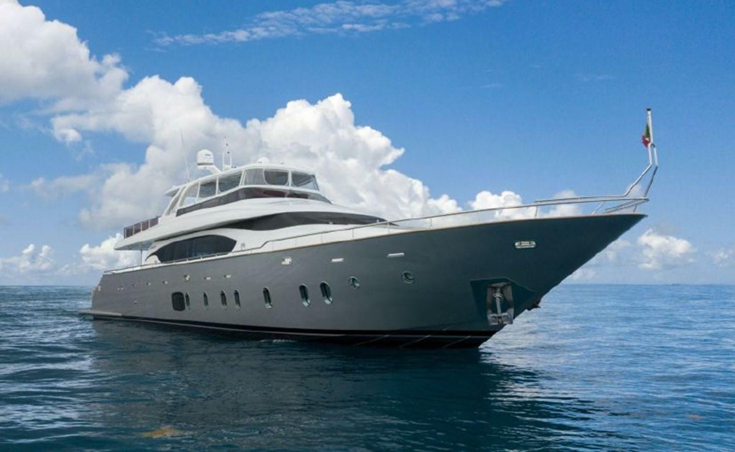 a large white yacht in the water aboard VITA XL Yacht for Sale