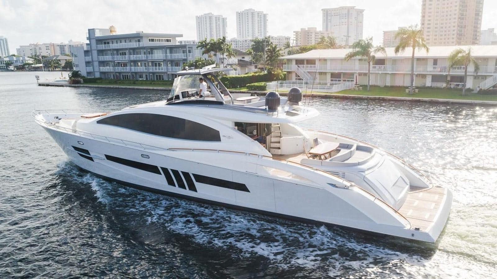 a white yacht on the water aboard HELIOS Yacht for Sale