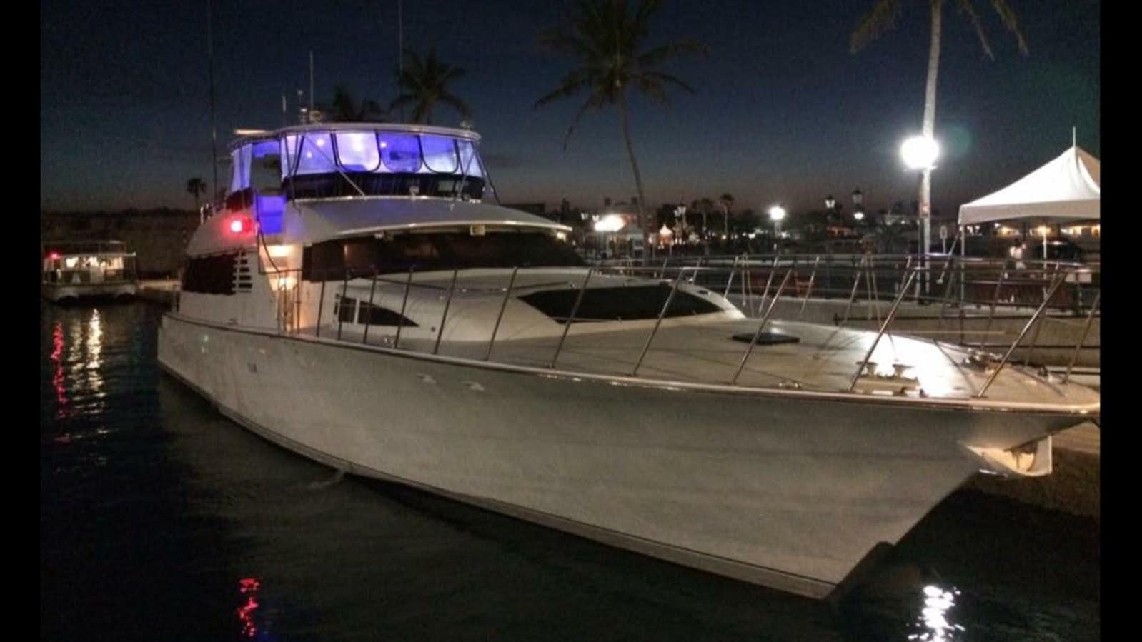 a large yacht at night aboard LADY CHARLOTTE Yacht for Sale
