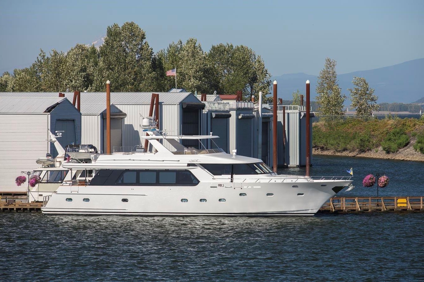 a large white boat in a harbor aboard SILVER WINGS Yacht for Sale