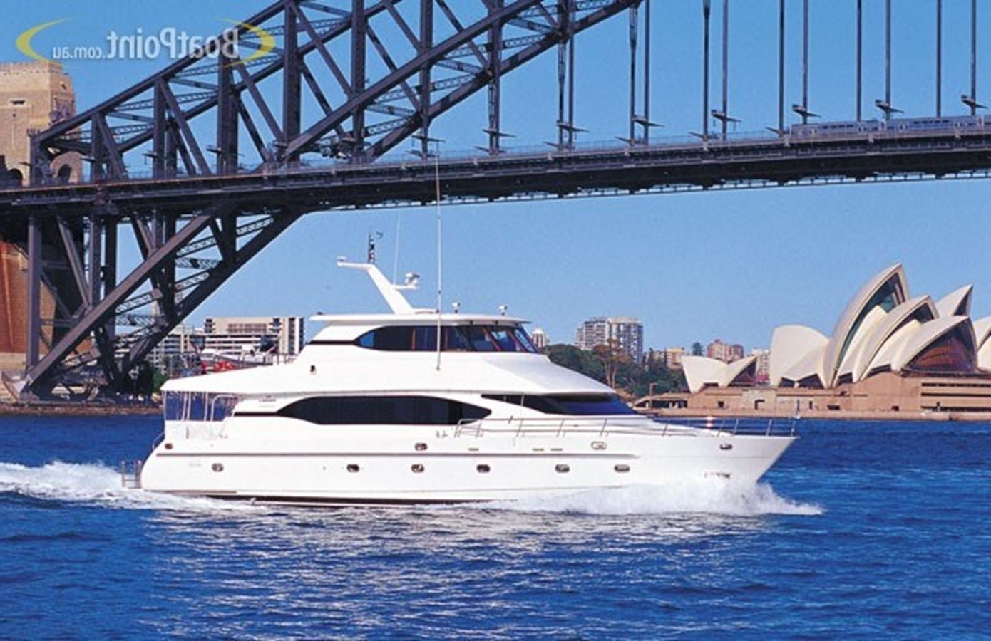 a white boat in the water aboard OCEANOS II Yacht for Sale