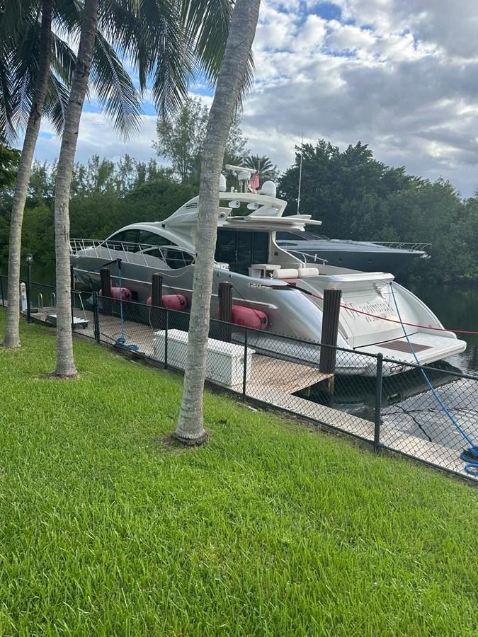 a boat parked on the grass aboard KNOTORIOUS IV Yacht for Sale