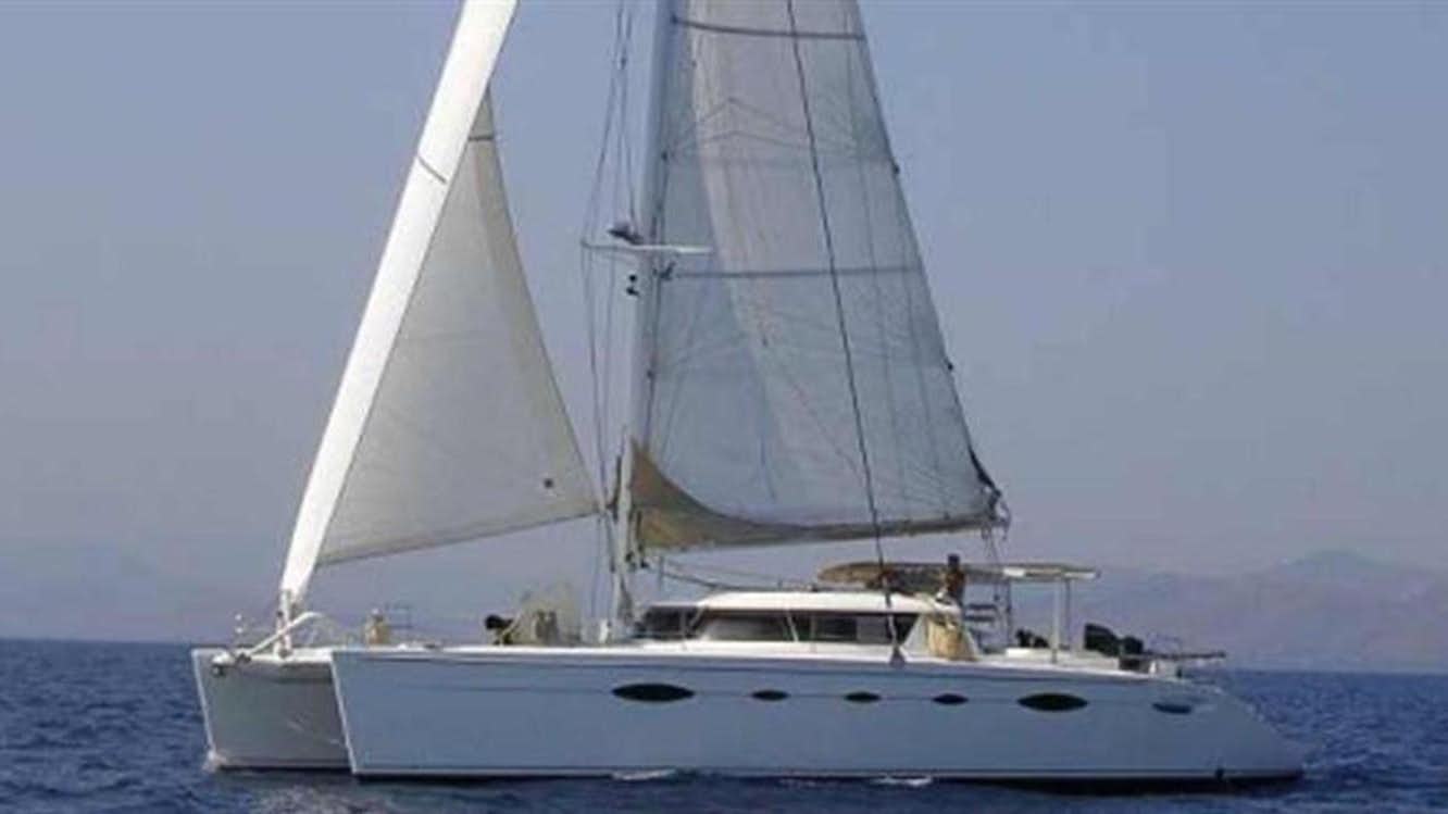 a sailboat on the water aboard 60' 2004 FOUNTAINE PAJOT ELEUTHERA "TAO II Yacht for Sale