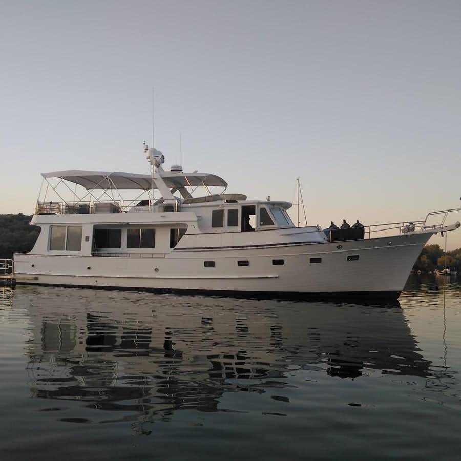 a white boat on water aboard GRAND LADY Yacht for Sale