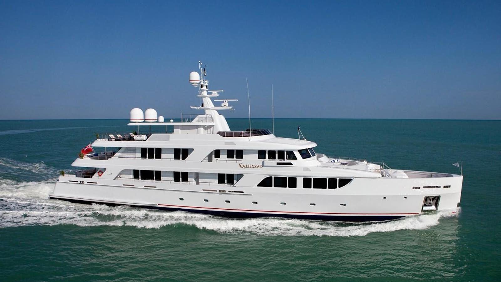 a large white boat in the ocean aboard KADIMO'S Yacht for Sale